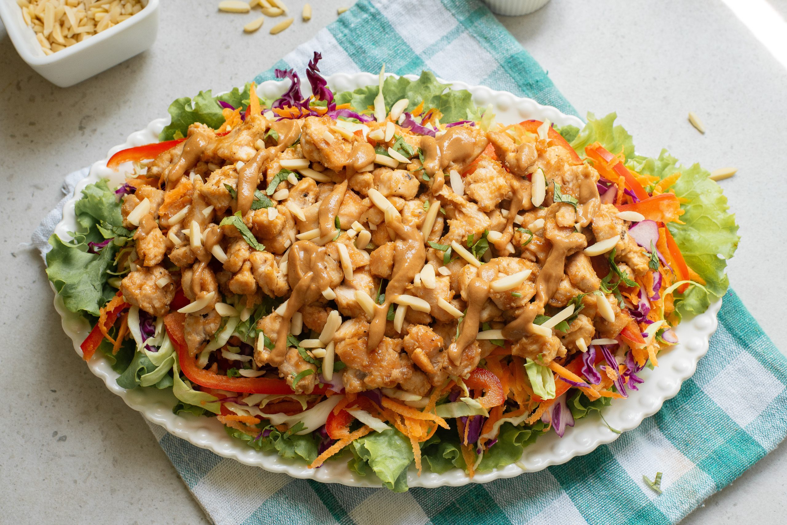 A plate of chicken salad on a table.