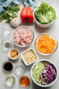 Asian chicken salad ingredients laid out on a table.