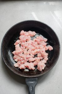 Fried chicken in a frying pan.