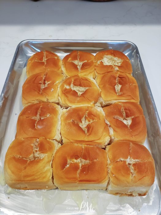 A tray of freshly baked dinner rolls.