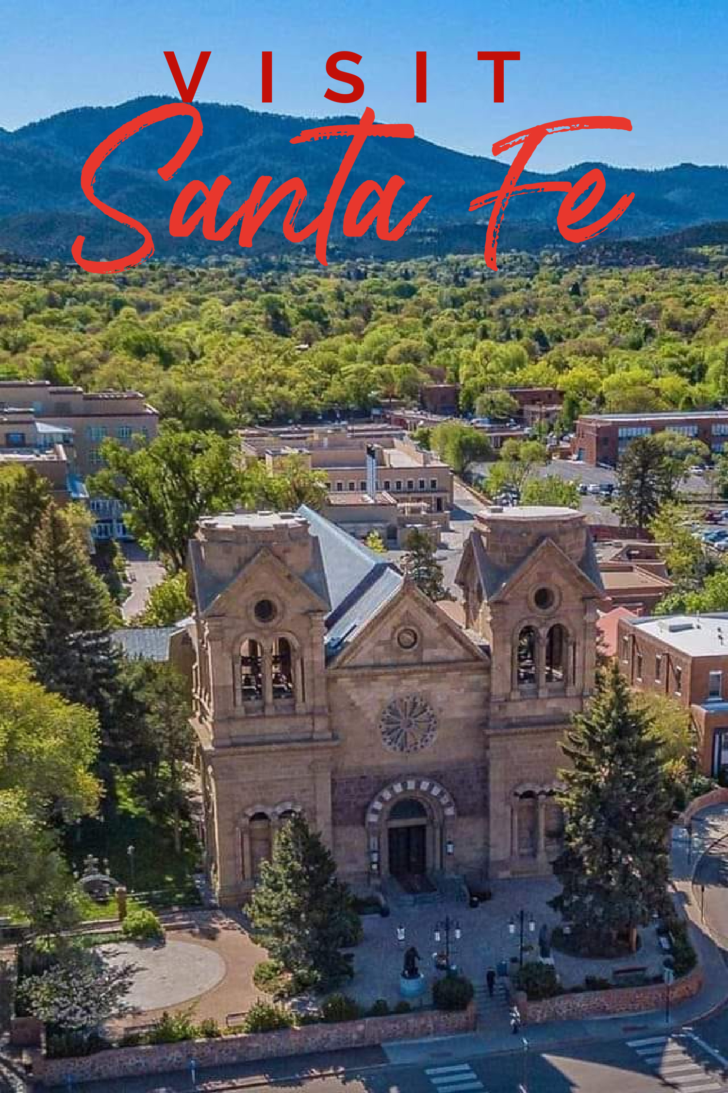 Aerial view of the cathedral basilica of Saint Francis of Assisi in Santa Fe, capturing "things to do in Santa Fe" with a "visit Santa Fe" inscription.