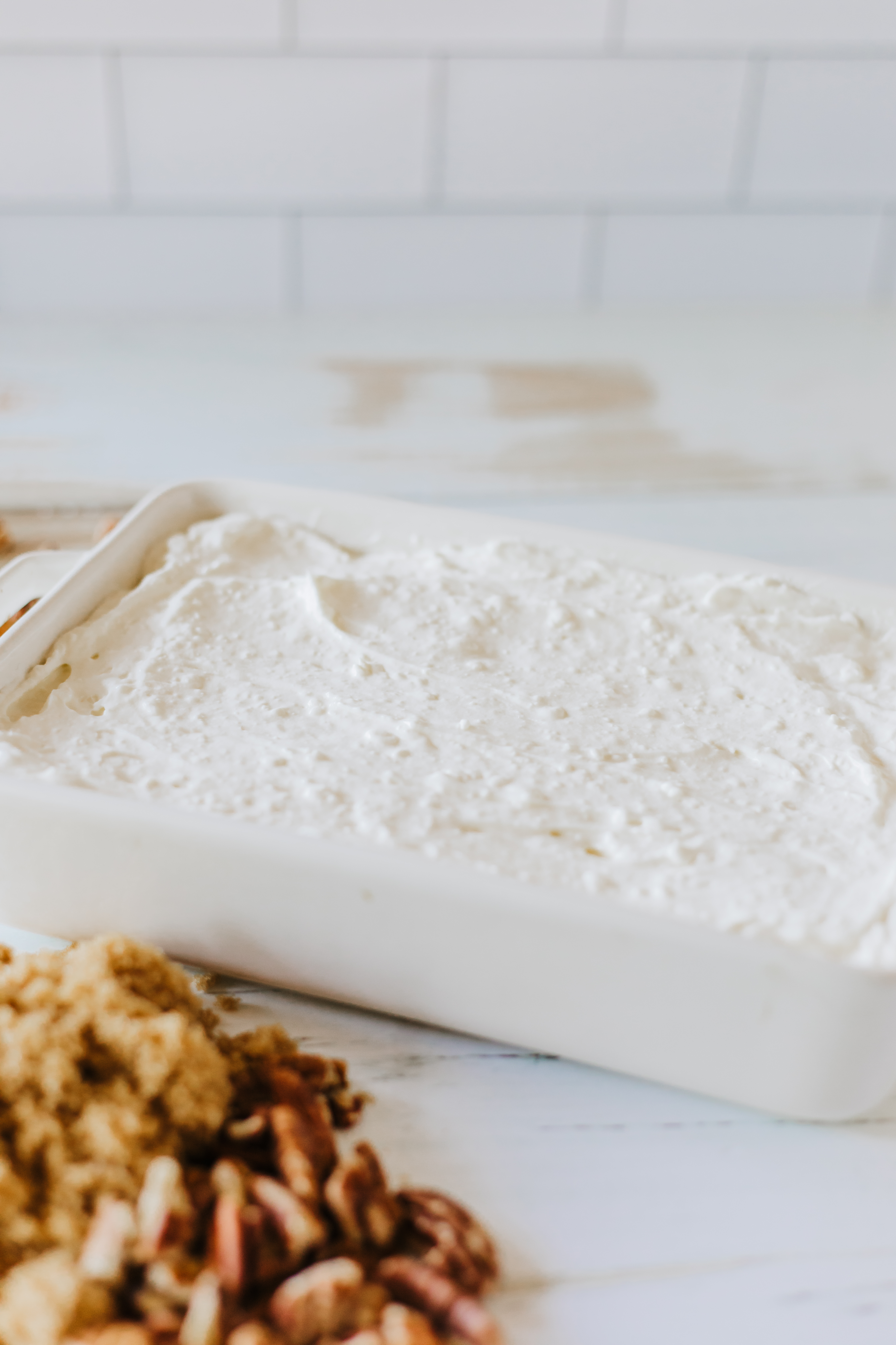 Cream cheese mixture in a baking dish.