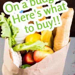 Paper bag with lettuce, apples, baguette, a carton of milk, and assorted vegetables. Text overlay reads, "On a budget? Here's what to buy!!.
