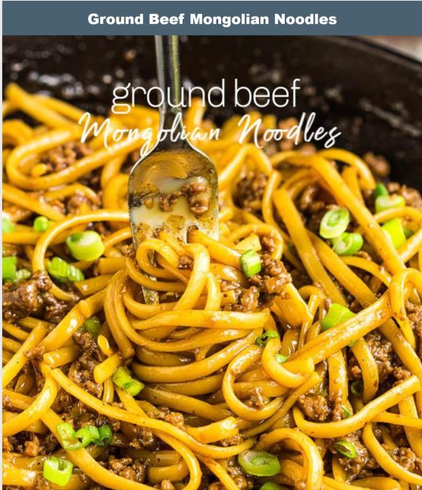 A close-up of ground beef Mongolian noodles in a pan, with a fork twirling noodles topped with sliced green onions.