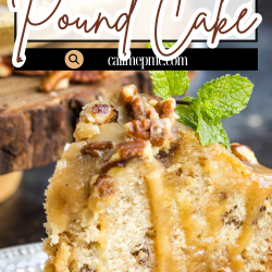 A slice of bourbon pecan praline pound cake topped with caramel glaze and pecans sits on a white plate, garnished with a sprig of fresh mint.