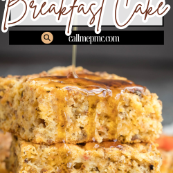 A stack of Sausage Cheddar Breakfast Cake squares drizzled with syrup, showcasing slices of sausage and cheddar baked right in.