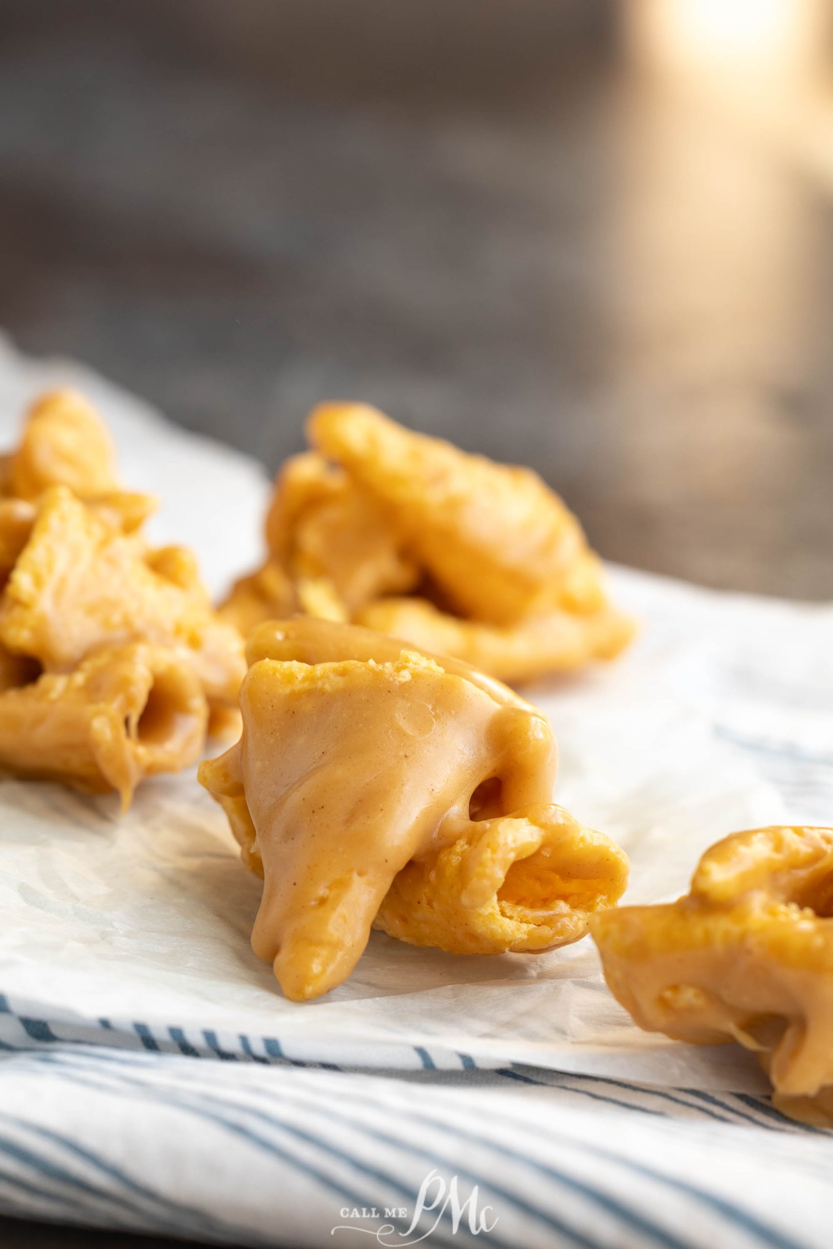 Close-up of clusters treats on a white cloth, set against a blurred background.