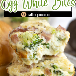 Two Muffin Tin Egg Bites with broccoli and ham are stacked on a plate, showcasing their texture and fresh ingredients.