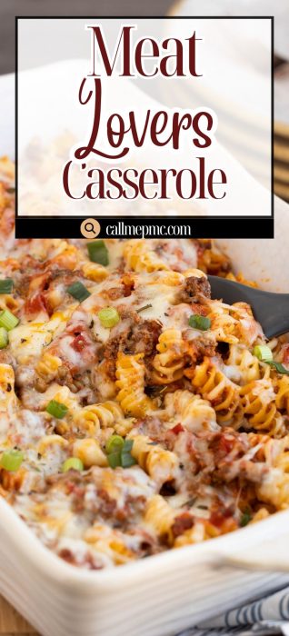 A baked meat lovers casserole with rotini pasta, ground meat, melted cheese, tomato sauce, and green onion garnish in a white dish.