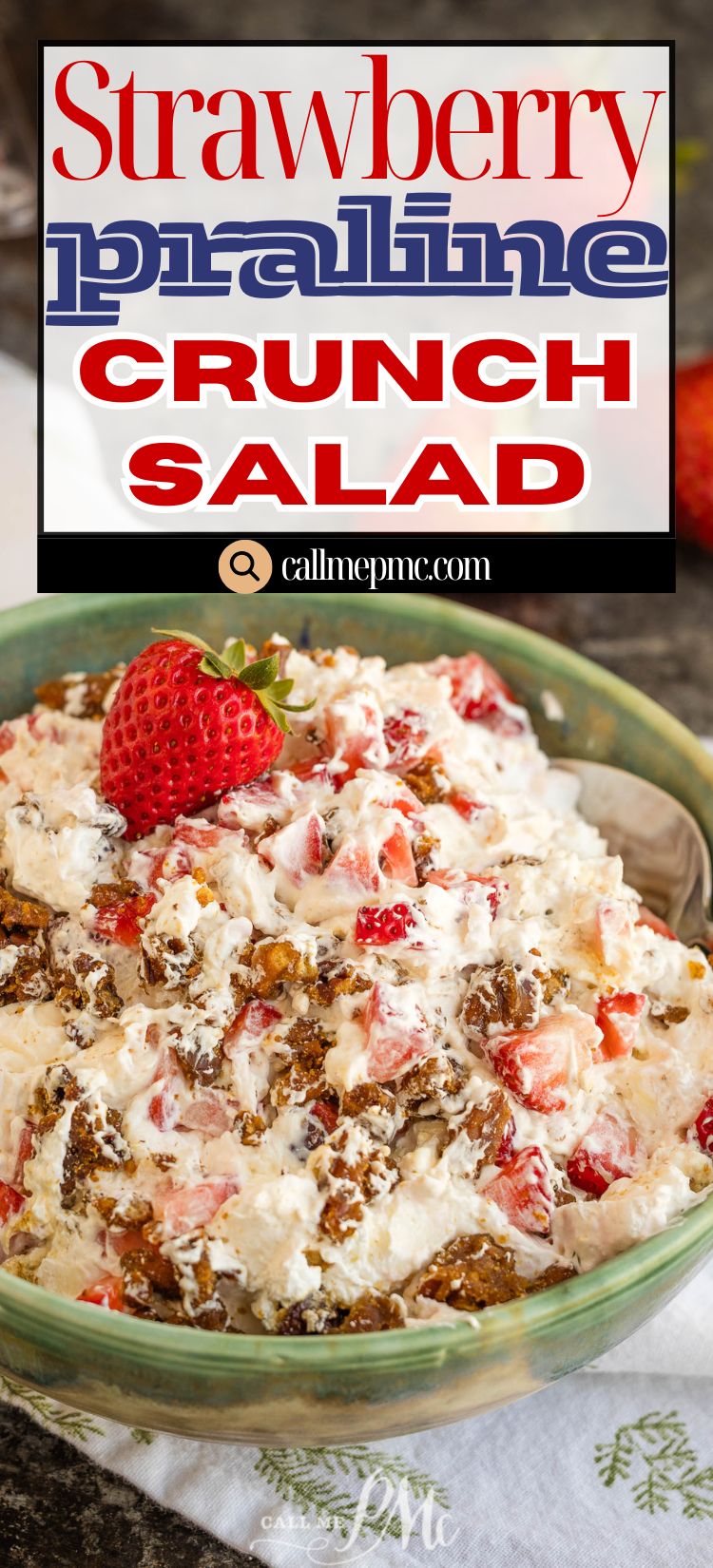A bowl of strawberry praline crunch salad topped with a fresh strawberry, featuring a label that reads "Strawberry Praline Crunch Salad" from callmepmc.com.