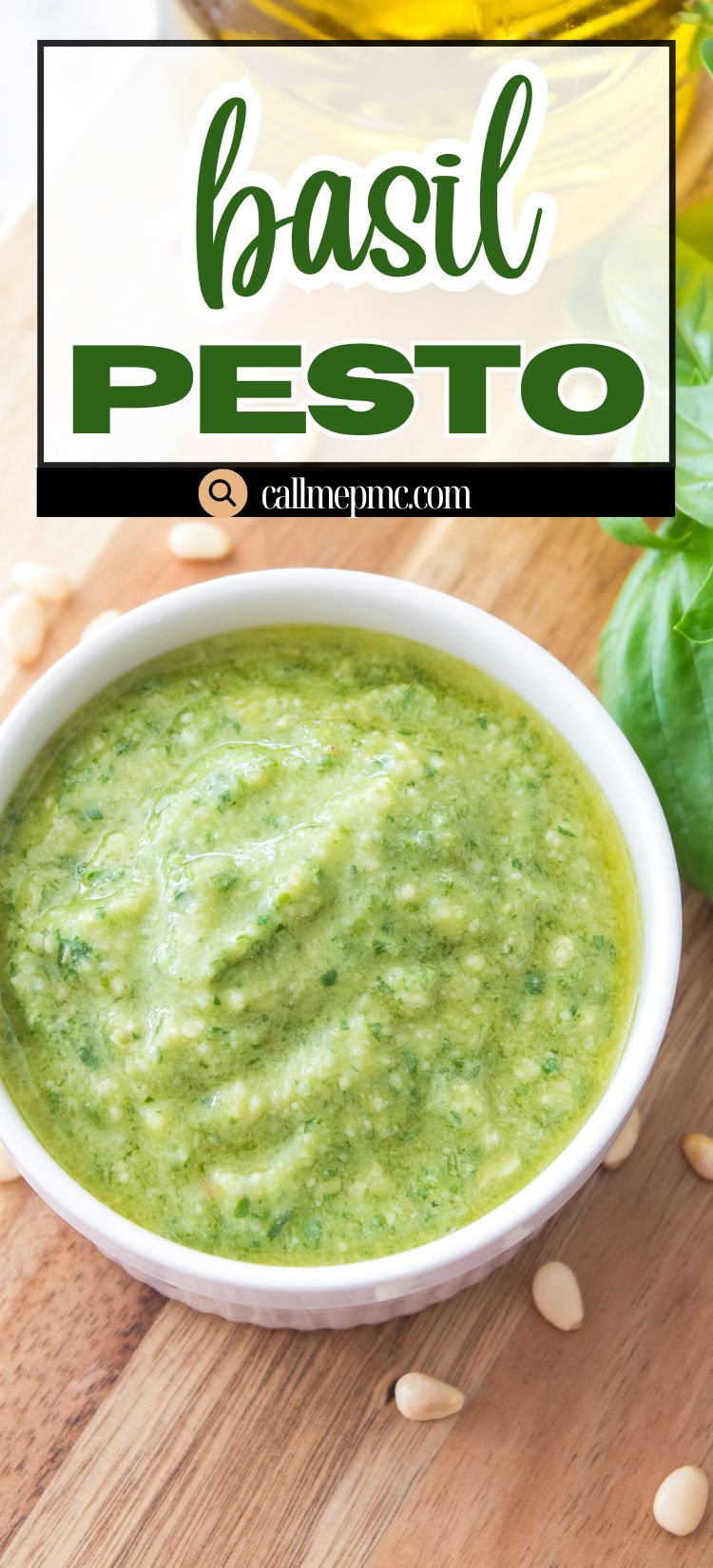 A white bowl filled with classic basil pesto sauce on a wooden surface, surrounded by pine nuts and fresh basil leaves.