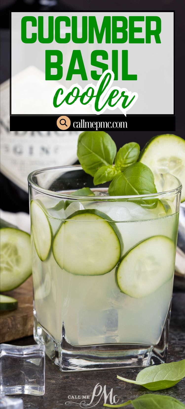 A glass of Cucumber Basil Gin Cooler with ice, cucumber slices, and basil leaves, set on a table with fresh ingredients and a bottle in the background.