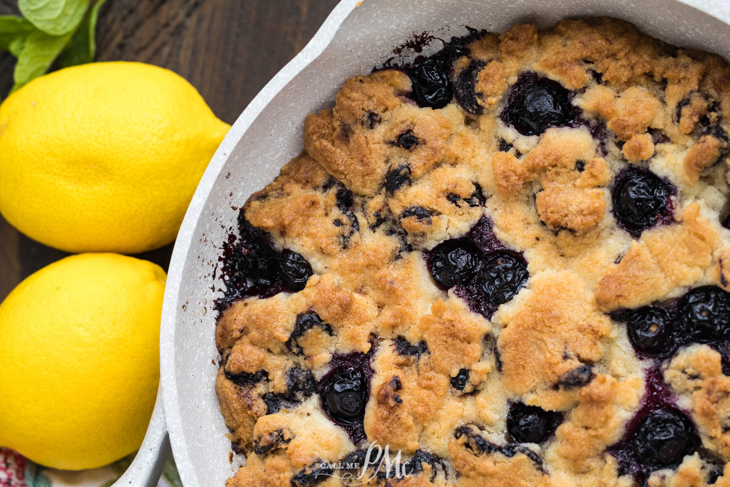 Close-up of a baked cobbler in a round dish,.