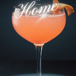 A coupe glass filled with a pink cocktail garnished with an orange peel, with the text "How to make cocktails at home" above it, inspiring you to make cocktails at home with style and flair.