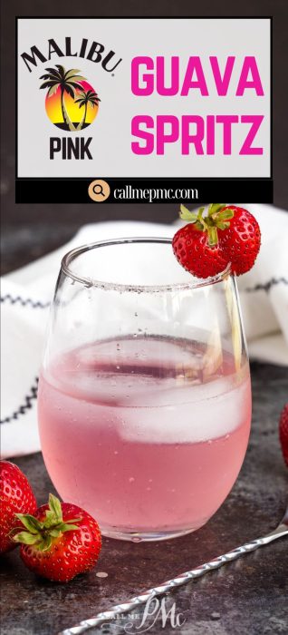 A glass of pink guava spritz garnished with strawberries on a table, with a towel and more strawberries in the background. Text reads "Malibu Pink Guava Spritz callmepmc.com".