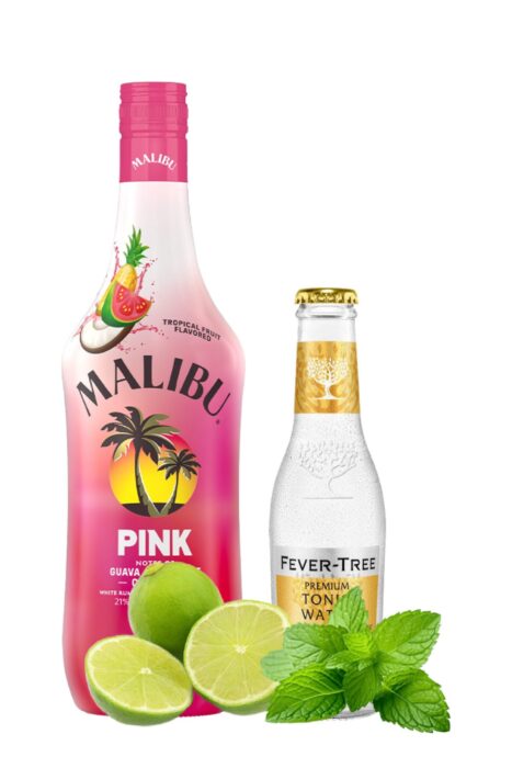 A bottle of Malibu liqueur and a bottle of Fever-Tree Premium Tonic Water are displayed with fresh lime halves and mint leaves in front of them on a white background. Easy summer mojito recipe.