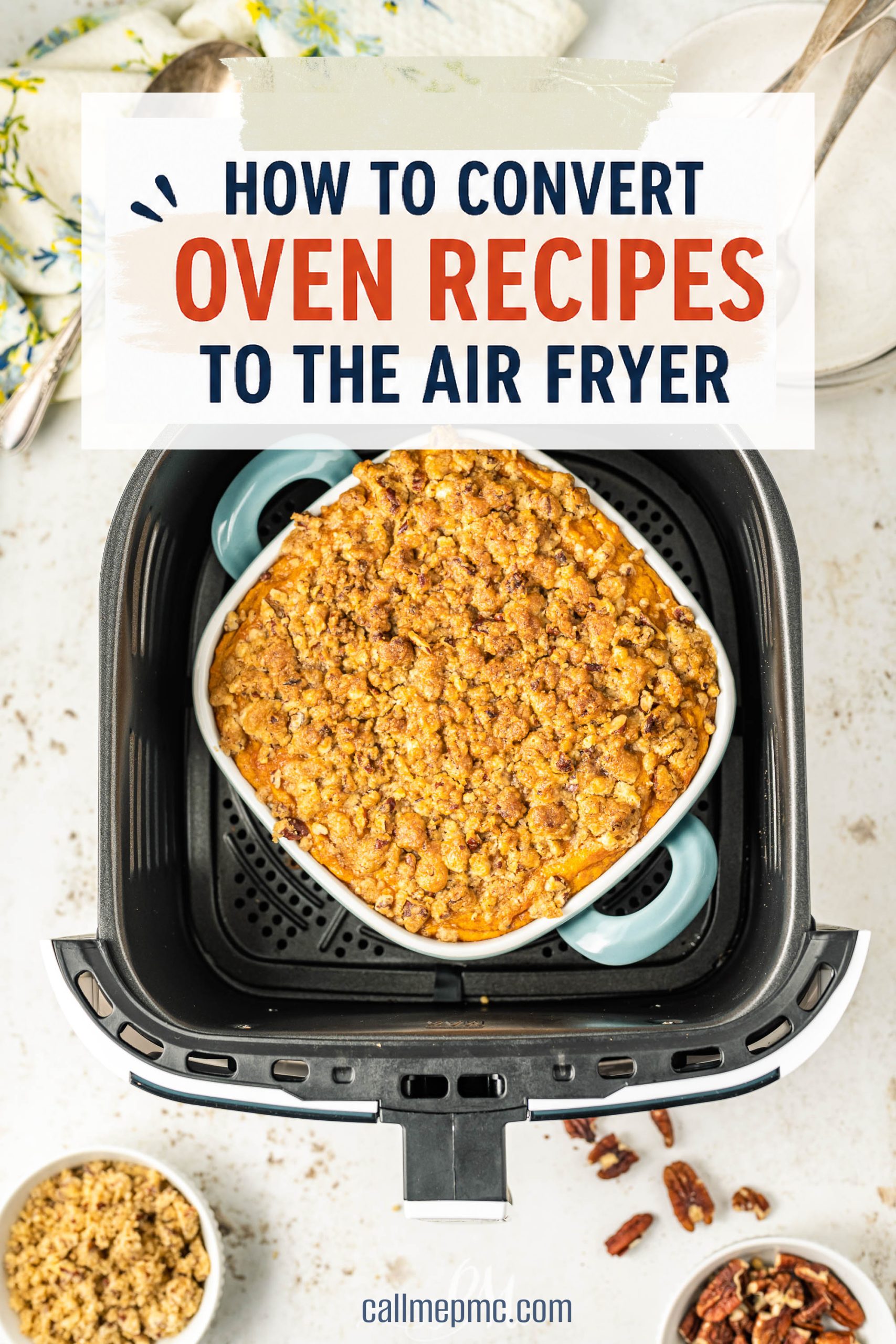 A casserole dish with a crumble topping sits inside an air fryer basket. Text above reads: “How to convert oven recipes to air fryer for easy and delicious meals.”.