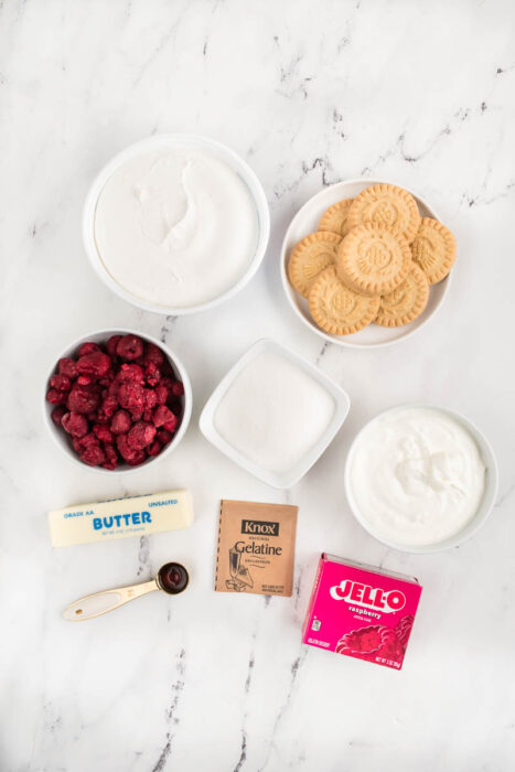 A flat-lay view of ingredients on a white marble surface. 